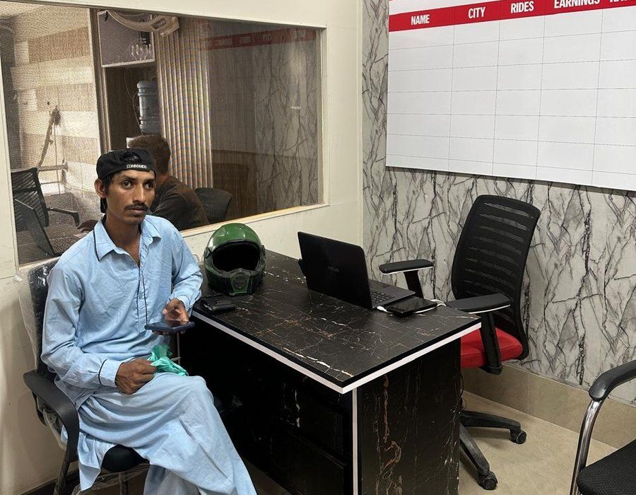 A driver at the registration desk in the Capital Captains office